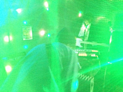 Furthers, flooded with green lights on stage (January 2016)